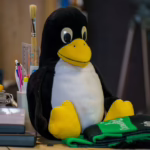 colorful workspace with penguin plush toy